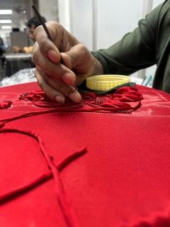 Appliqué after out-turning satin